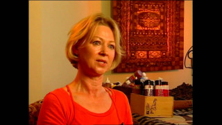 Woman red shirt sitting room - bright studio setting free wallpaper