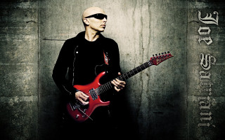 Man sunglasses red guitar wall - holding free wallpaper for desktop