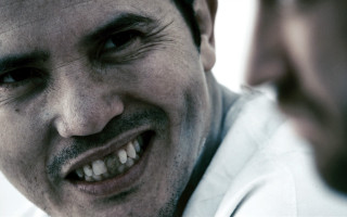 Smiling man with tie looking - the camera man free wallpaper