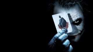 Man holding joker card knife 3 - a card free wallpaper