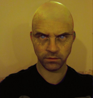 Bald man blue eyes serious - daryush shokof free wallpaper for tablet