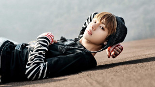 Young man laying ground hands - a young man free wallpaper