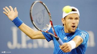 Man swinging tennis racket ball - free sports wallpaper