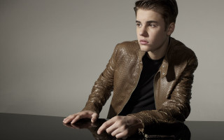 Man sitting table brown jacket 2 - a brown jacket free wallpaper