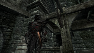 Man black outfit stone building - a wooden door free wallpaper