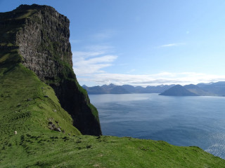 Grassy hill water mountains blue - the background and mountains free wallpaper
