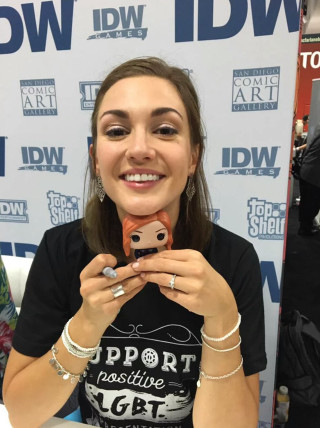 Woman holding cell phone smiling - fine free wallpaper for mobile