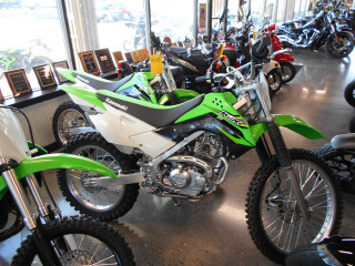 Green white dirtbike inside building - inside free wallpaper