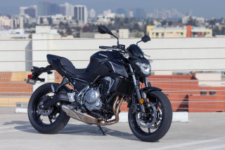 Black motorcycle parking lot city - building free wallpaper