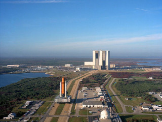 Rocket field city lake building - free airplane wallpaper