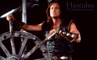 Man costume sword wheel holding - heroic pose free wallpaper