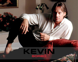 Man sitting bed room painting - a red chair free wallpaper