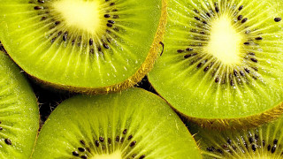 Kiwi slices closeup stacked bite - a bite free wallpaper
