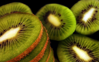 Kiwi fruit sliced closeup stacked - half free wallpaper