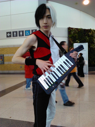 Man red vest keyboard lobby - cosplay free wallpaper for mobile