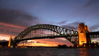 Bridge water night sky clouds - a city in the foreground free wallpaper