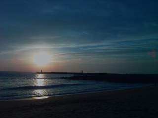Beach pier sunset water person - the beach in the distance free wallpaper