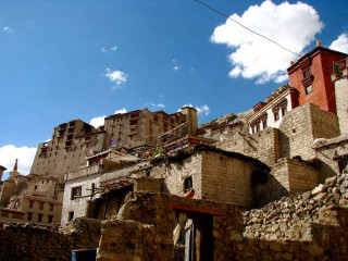 Stone building sky background clouds - a stone building free wallpaper