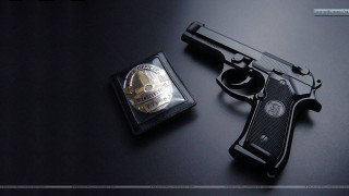 Gun badge black surface silver - a black surface free wallpaper for desktop