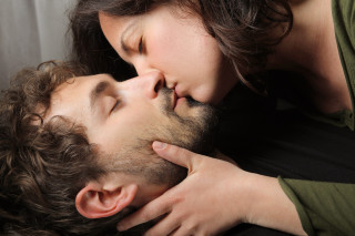Woman kissing man eyes closed - close free wallpaper