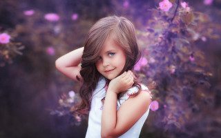 Young girl purple background flowers 3 - a young girl free wallpaper