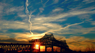 Bridge sunset contrail sky background - a sun setting behind free wallpaper