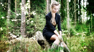 Woman sitting rock forest background - anka zhuravleva free wallpaper