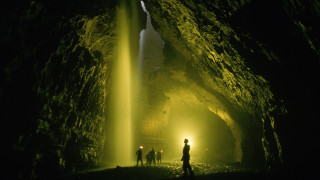 Cave people waterfall light ceiling - a cave free wallpaper