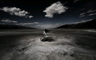 Woman sitting rock desert mountains - brooke shaden free wallpaper