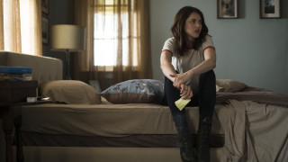 Woman sitting bed yellow sponge - her other hand free wallpaper