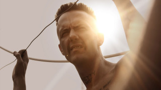 Man holding string smiling right - he free wallpaper