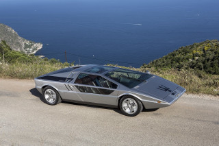 Silver sports car ocean mountains - retrofuturism free wallpaper