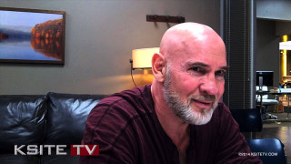 Bald man goatee couch living - a couch in a living room free wallpaper