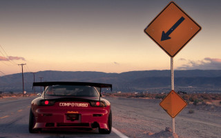 Red sports car road sign 2 - a red sports car free wallpaper