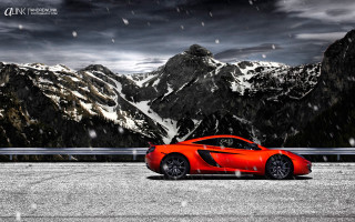 Red sports car mountain snow - a red sports car free wallpaper