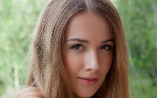 Eszter blonde hair green background - a half free wallpaper