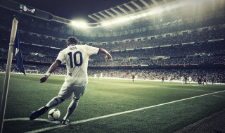 Soccer player kicking ball stadium 2 - a soccer player free wallpaper