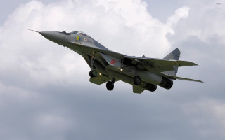 Fighter jet cloudy sky landing 2 - the side of the jet free wallpaper