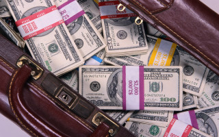 Suitcase full of money bills - the top free wallpaper