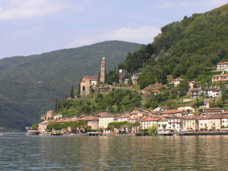 Village hill water clocktower mountain - a village free wallpaper