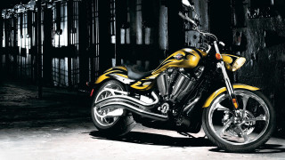 Yellow motorcycle dark room fence - a yellow motorcycle free wallpaper