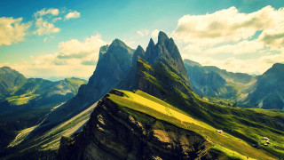 Mountain range grassy field blue - a grassy field below free wallpaper