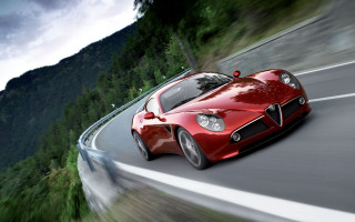 Red sports car mountain road 4 - a cloudy sky above free wallpaper