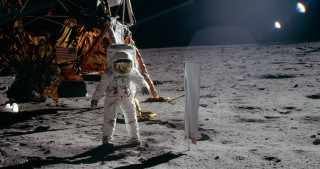 Man white astronaut suit moon - free space wallpaper