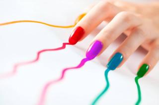 Woman hand multicolored manicure nail - a womans hand free wallpaper