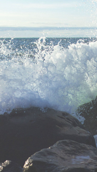 Person riding surfboard wave ocean 3 - a surfboard free wallpaper for mobile