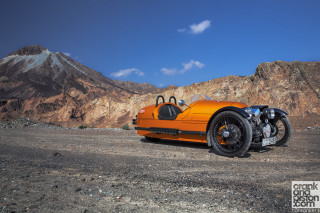 Orange motorcycle mountain range sky - dieselpunk free wallpaper