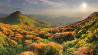 Grassy valley mountains sun sky - ada hill walker free wallpaper