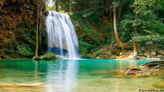 Waterfall forest clear blue river 2 - a waterfall in a forest free wallpaper