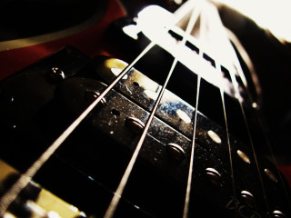 Guitar neck closeup blurry background - grunge free wallpaper